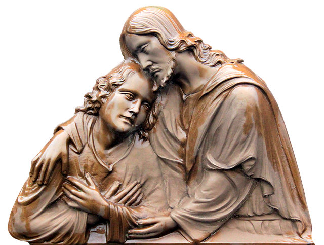 A boy is resting his head on Jesus' shoulder. Jesus responds by placing His arms around the boy as a sign of care and protection.