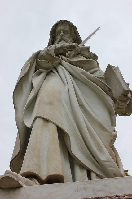 A statue of St. Paul wielding a sword. He is holding a book in his left hand.