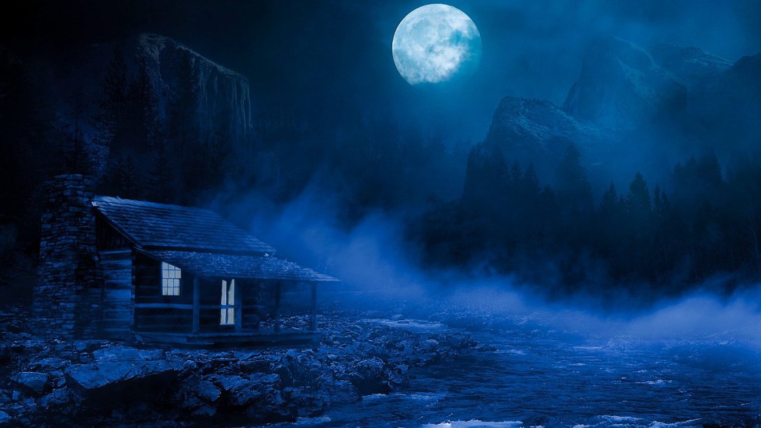 In the dark of night a small log cabin can be seen in the bottom left corner of the image. Its lights are on, but nobody is visible from the outside. A river is near the house. Rolling fog is over the water. The moon stands watch near the top of picture.