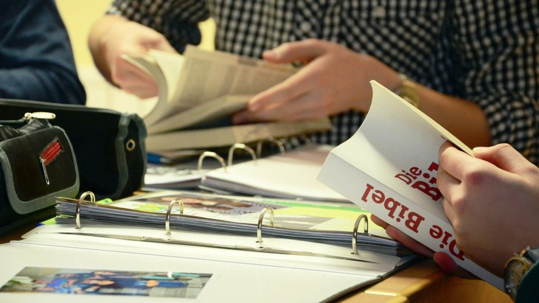 A group of people studying the Bible together.