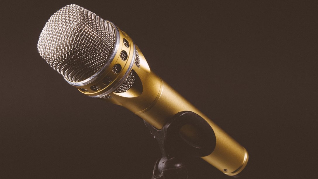A microphone on a small stand that appears to be in the dark.