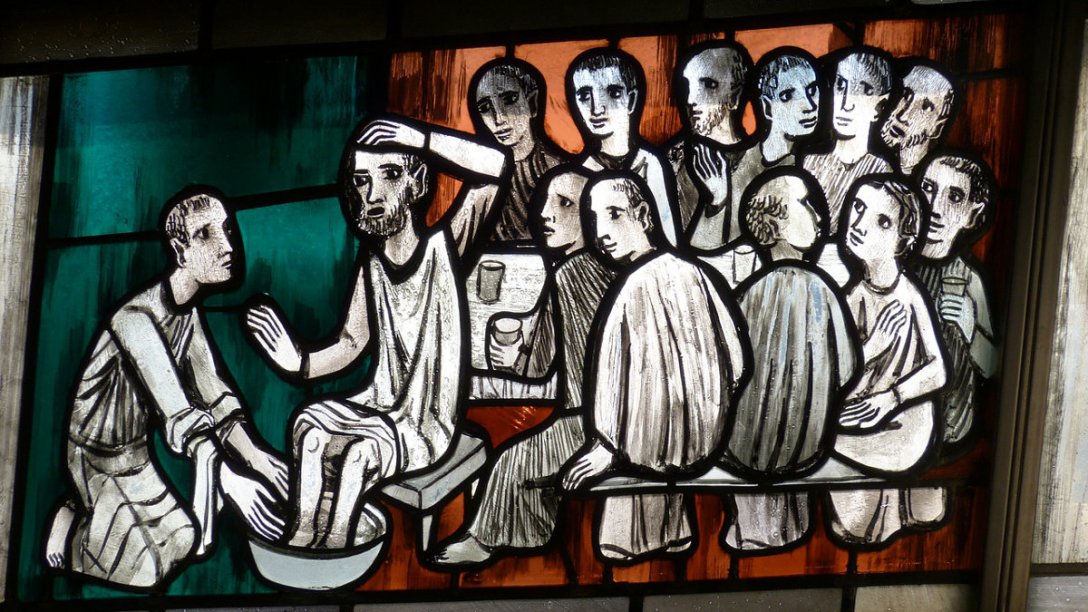 An illustration of Jesus washing the feet of the apostles.