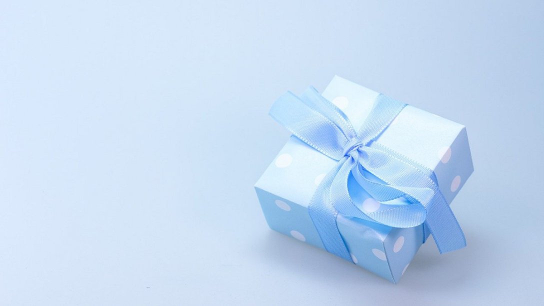 A gift wrapped in a white box.